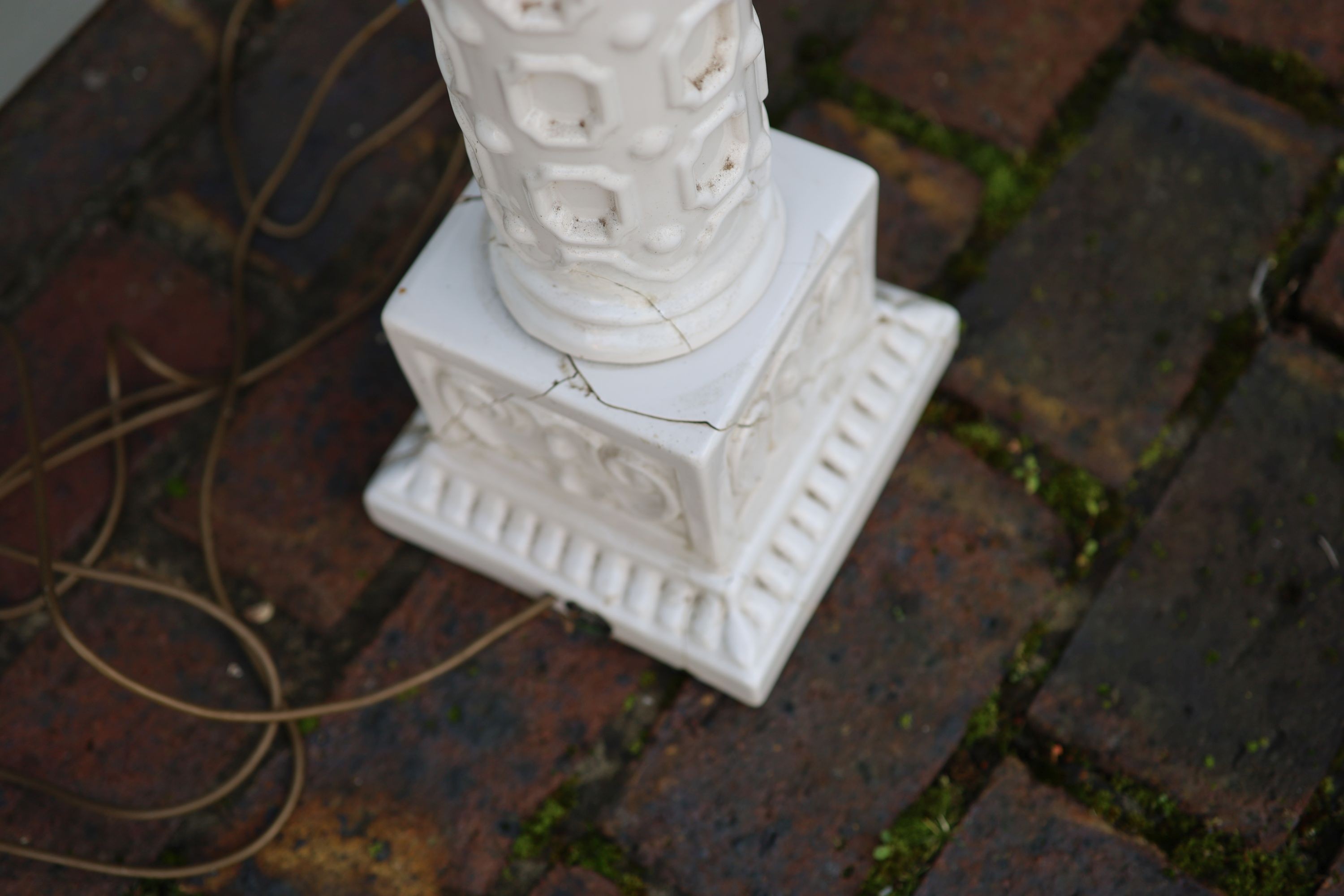 A pair of white glazed pottery table lamps, height to fittings 67cm (one a.f.)